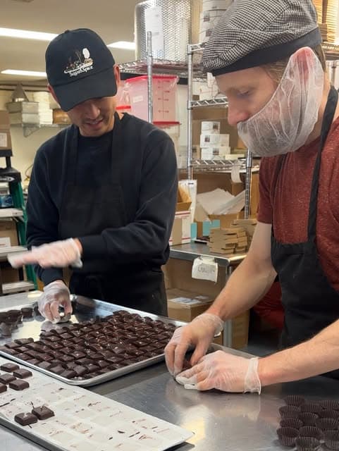 Rocket working on production alongside the team at Farmhouse Chocolates