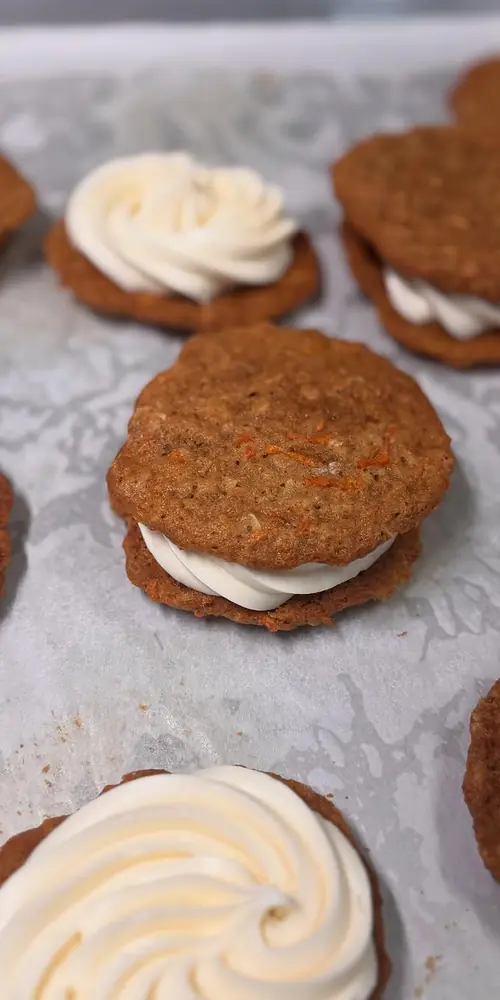 Carrot cake cookie sandwiches are back! We are open 8-1pm with lots of crullers, cinnamon buns and o