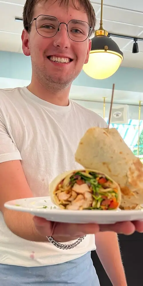 We have a Tuscan chicken salad wrap special with mesclun greens, carrot, red onion, bell pepper and