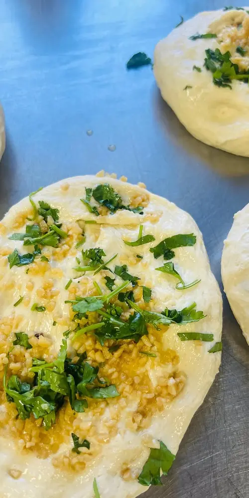 Making fresh naan for lunch!