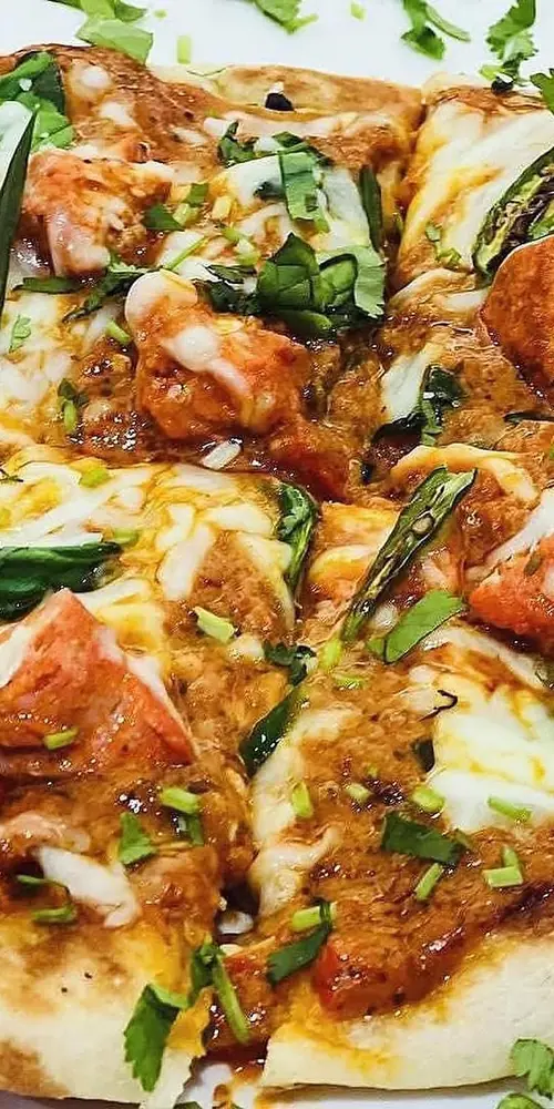 Dinner special will be butter chicken pizza (Naanza)