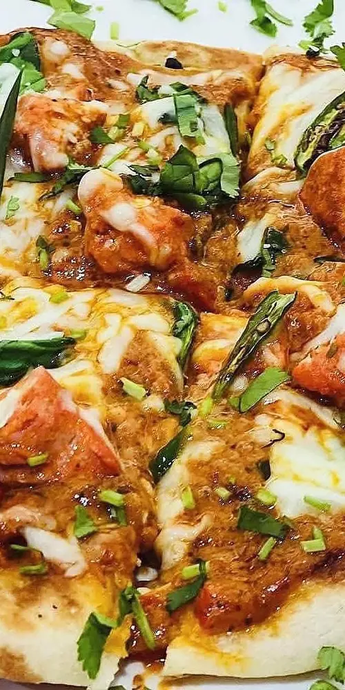 Dinner special will be butter chicken pizza (Naanza)