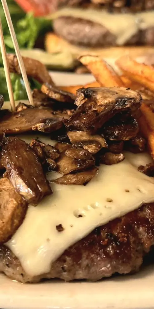 Have you tried our famous 50/50 Burger? Indulge in a 50% pork and 50% beef patty smothered in roaste