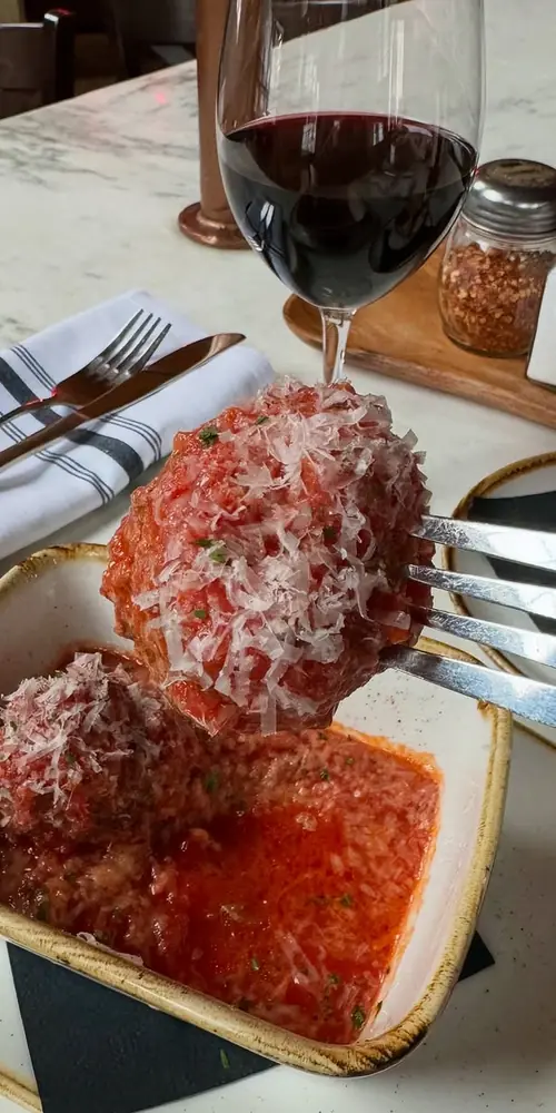 You deserve meatballs made with love, hand rolled, and served in homemade pomodoro with fresh grated