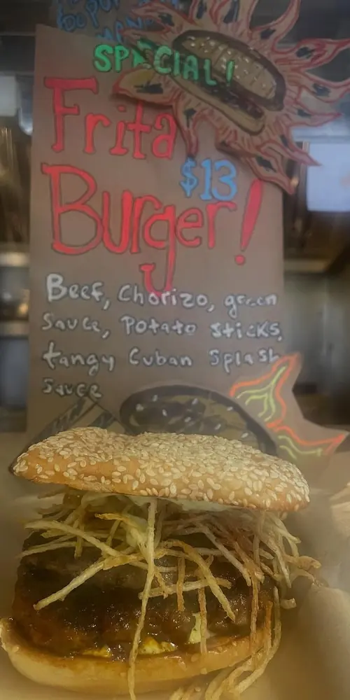 The Frita Burger is BACK! Beef, chorizo, shaved onions, tangy Cuban splash, green sauce, crisp potat