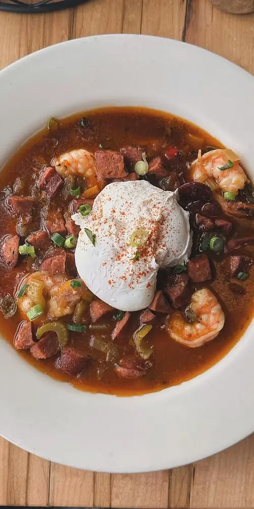 🦐🍤 Sautéed Shrimp and Andouille Sausage in a Cajun Broth over Cheddar Grits. Topped with 2 Poached E