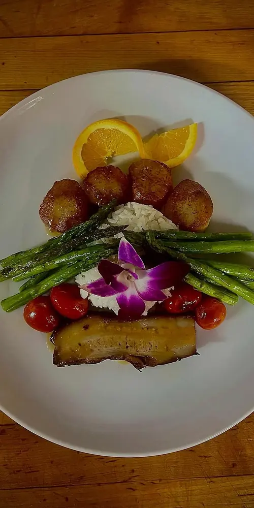 Our special tonight!
Seared scallops & slow roasted pork belly topped with a orange ginger glaze s