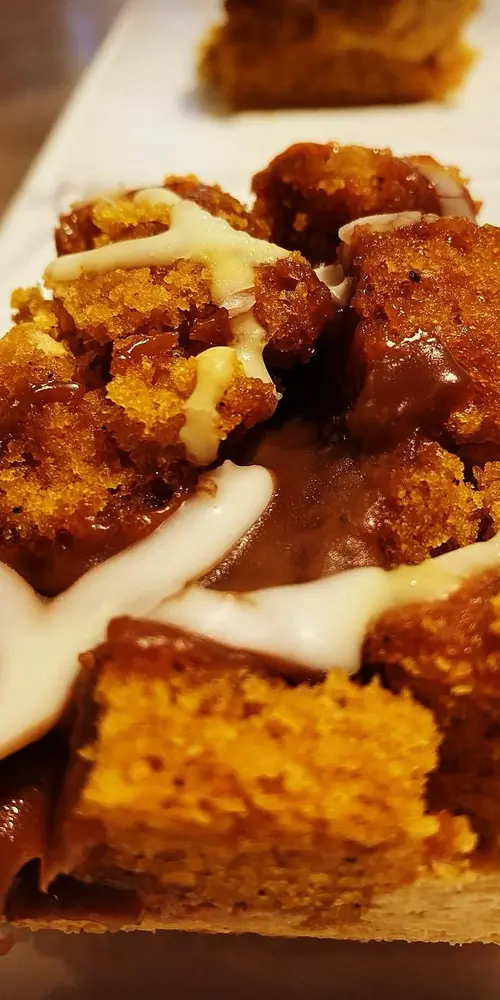 🍁🎃pumpkin mousse + caramel goeyness + fluffy cake + a little icing… basically fall baked into edible