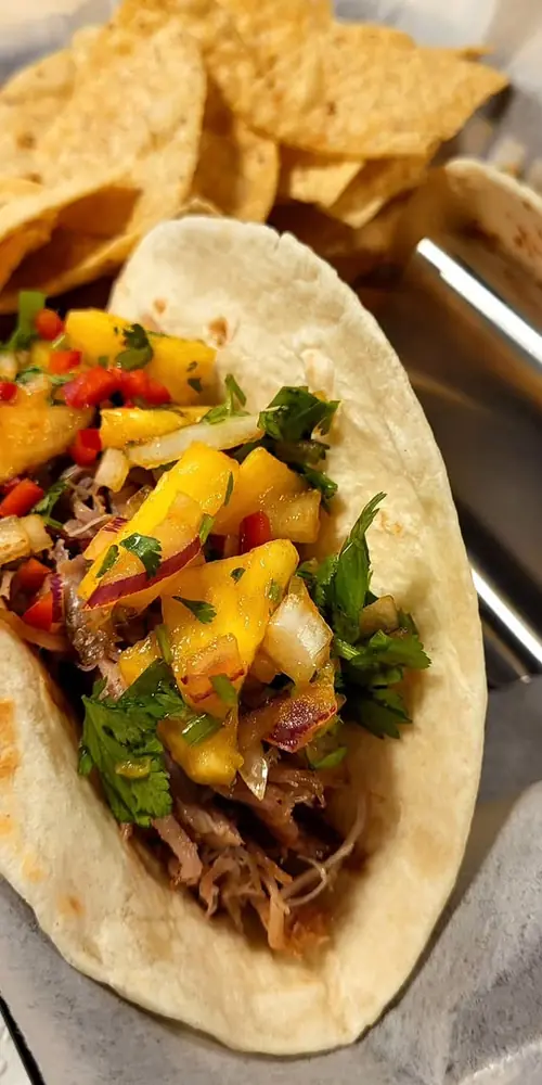 Taco Special! Slow roasted pork carnitas tacos with housemade smoky pineapple cilantro salsa. Availa
