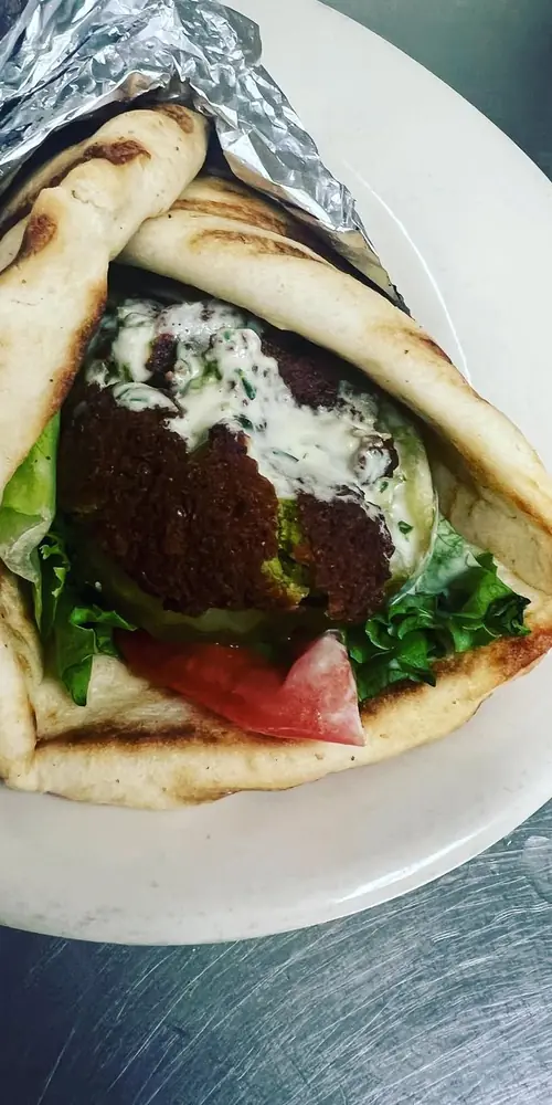 3 Bros Falafel wrap special! Delicious fried to order falafel, lettuce, tomato, pickles and tahini